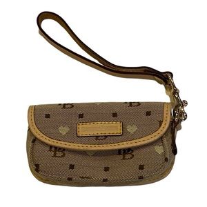 Dooney and Bourke small heart logo wristlet wallet tan fabric leather strap